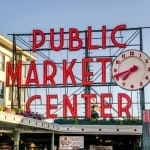 Pike Place Market Neon Sign at sunset in Seattle Washington.