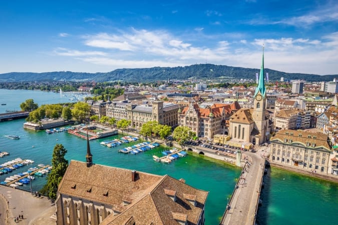 Aerial view of historic Zurich city center with famous Fraumunster Church and river Limmat