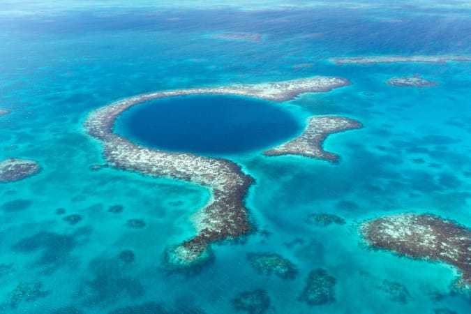 An aerial view of the famous diving spot, Blue Hole off the coast of Belize