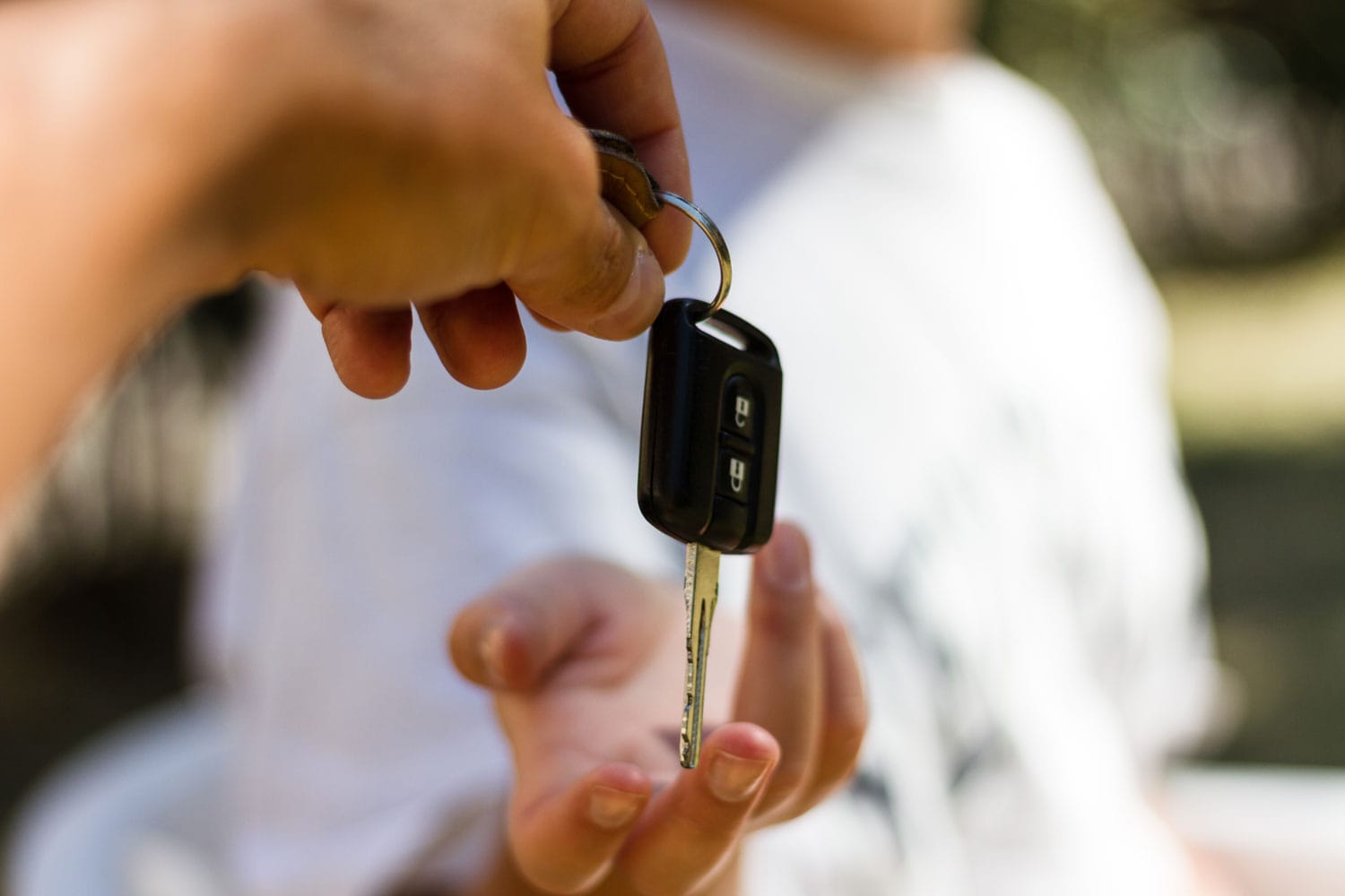 Girl receives a key to a car.