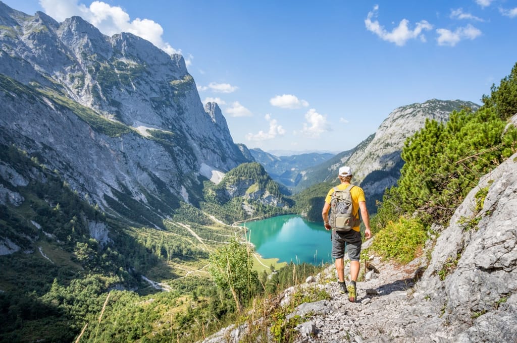 Mountaineer hiking in the mountains at Dachstein, Austria