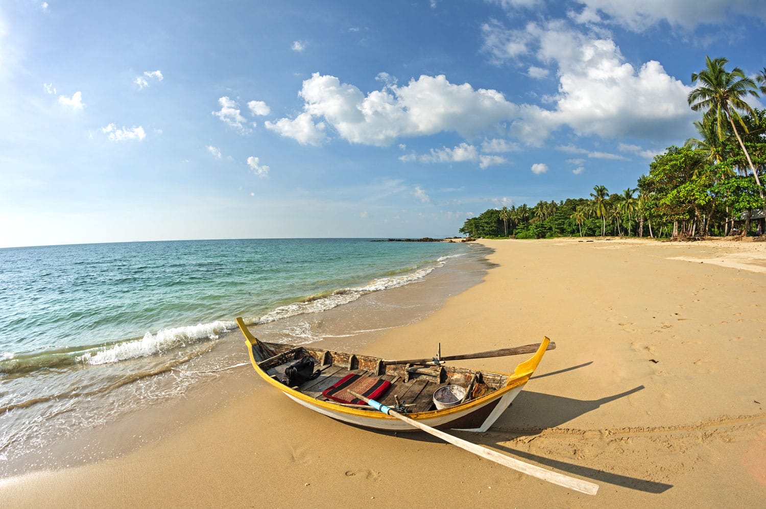 rowboat on a tropical beach in Koh Lanta Thailand