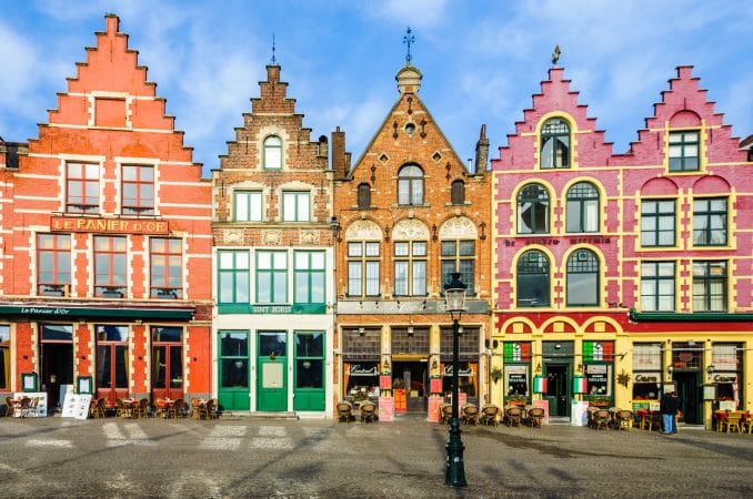 Colorful old brick houses in the Market Square in the UNESCO World Heritage Old Town of Bruges, Belgium