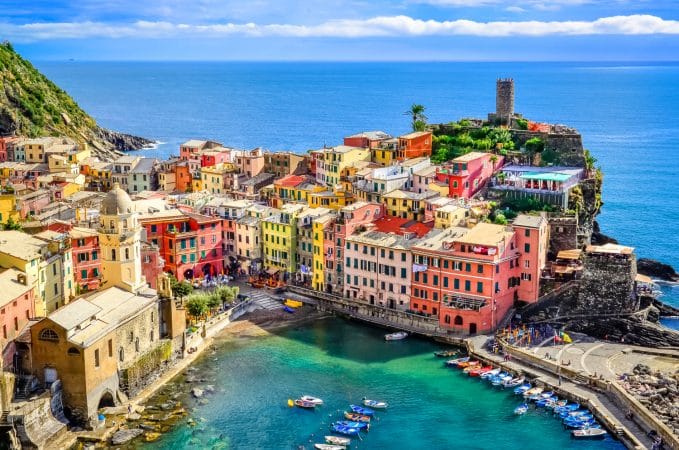 Scenic view of ocean and harbor in colorful village Vernazza, Cinque Terre, Italy
