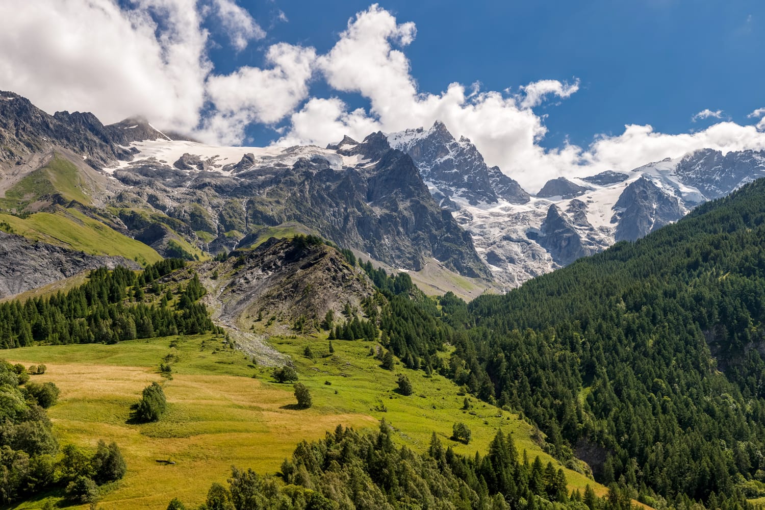 Summer view of the mountains and glaciers of the Ecrins National Park (La Meije and Glacier du Tabuchet) from the village of La Grave. Hautes-Alpes, PACA Region, Southern French Alps, France