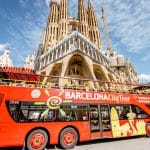 Tourist bus near the famous Sagrada Familia roman catholic church in Barcelona, designed by catalan architect Antoni Gaudi