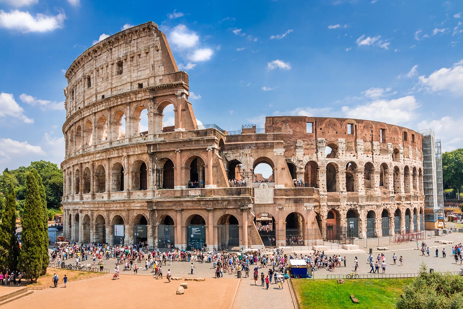 Colosseum with clear blue sky and clouds, Rome,Italy. Rome architecture and landmark. Rome Colosseum is one of the best known monuments of Rome and Italy