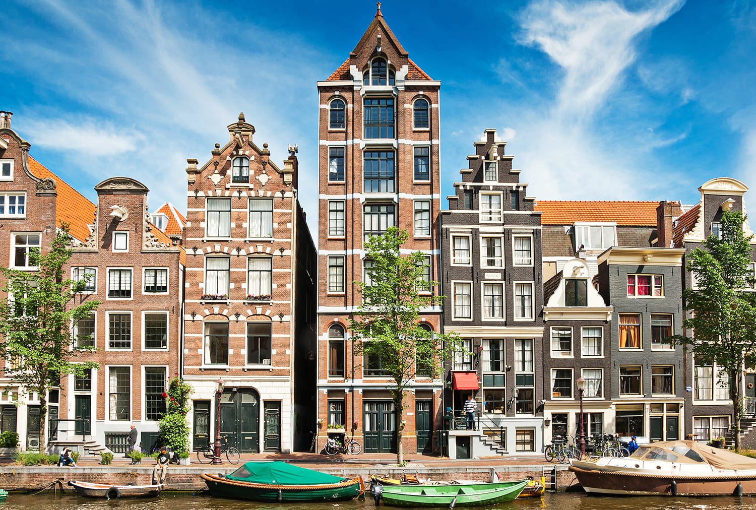 Amsterdam canals and typical houses with clear summer sky