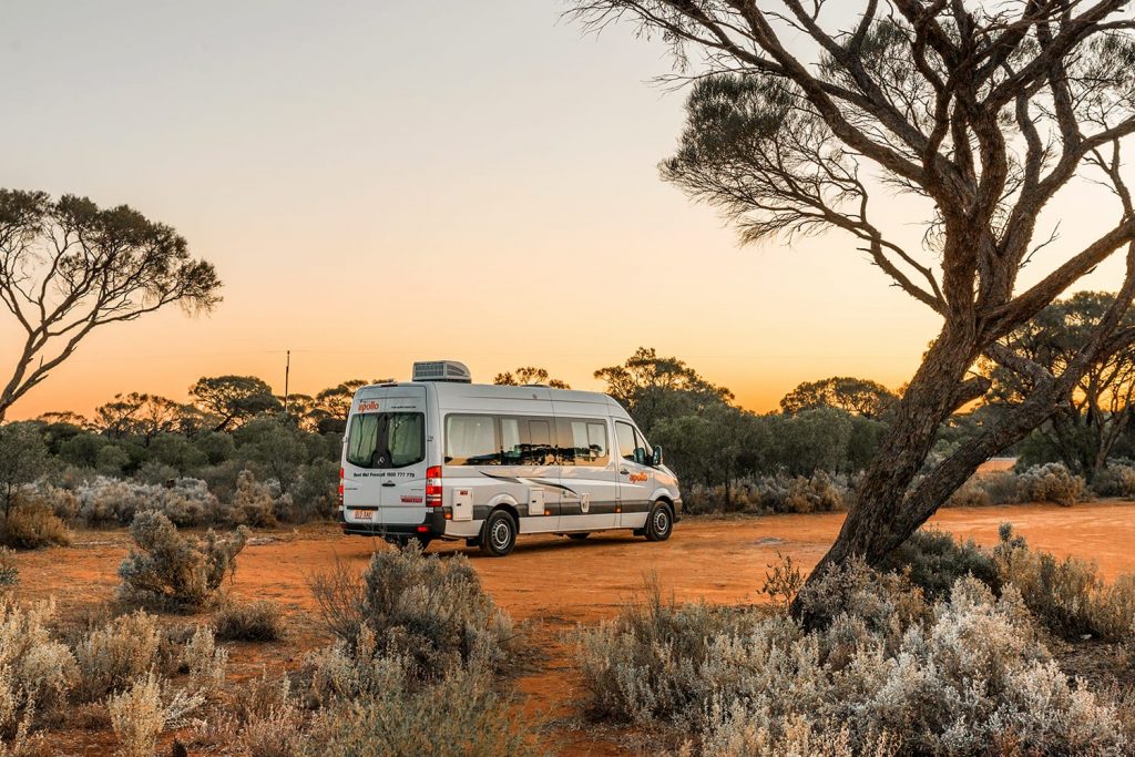 Australian rented motorhome stopped in at bush campgroung in Flinders Ranges region near Port Augusta at sunset. Australia