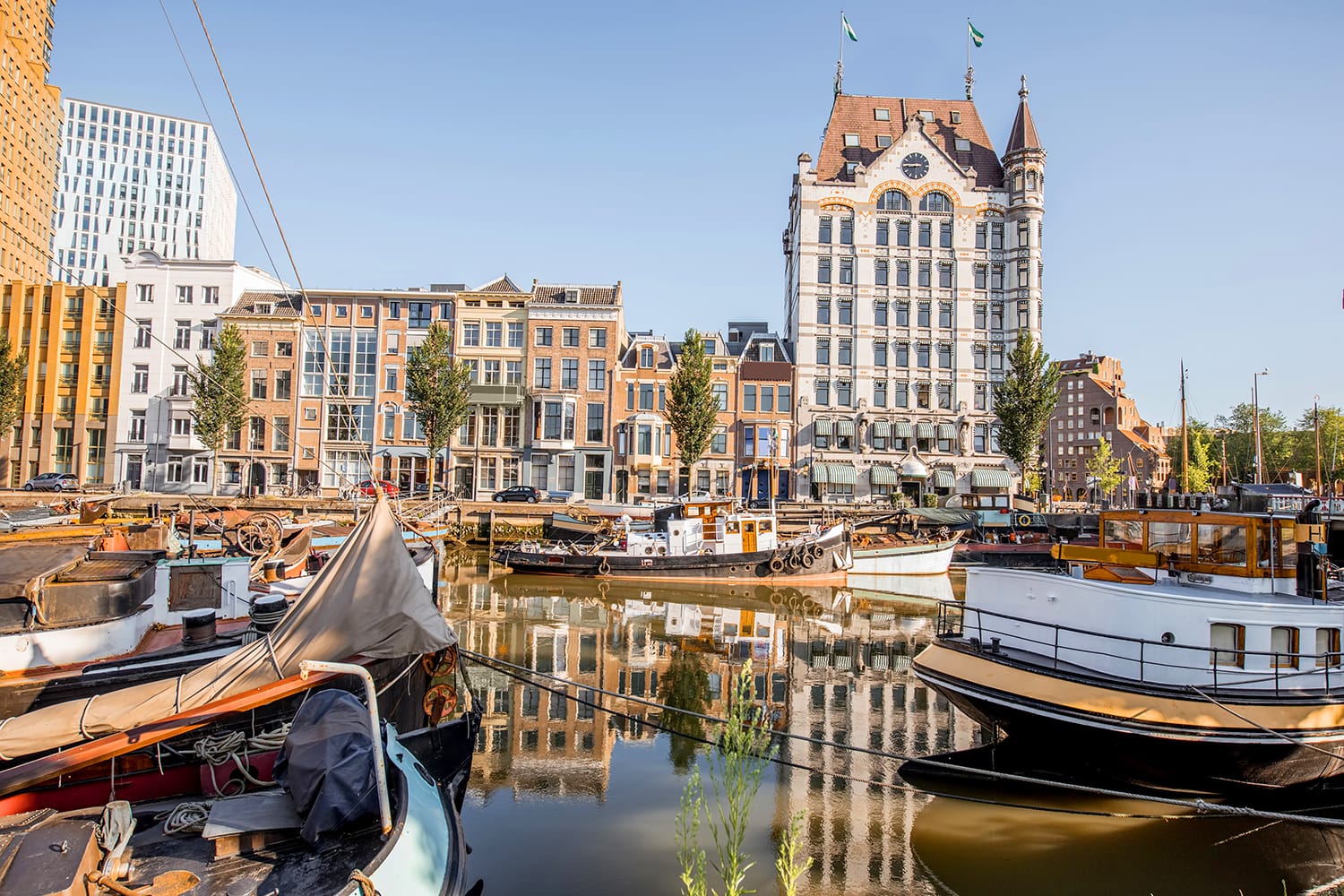View on the old part of Wijn haven with boats during the morning in Rotterdam, Netherlands