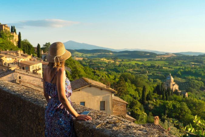 Montepulciano, Tuscany, Italy, Girl looks at the landscape of the city and countryside from the balcony