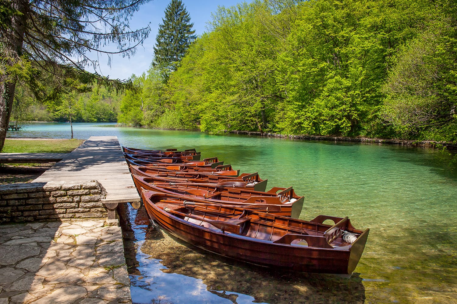 Row of wooden rowboats waiting for tourists, Plitvice National Park, Croatia