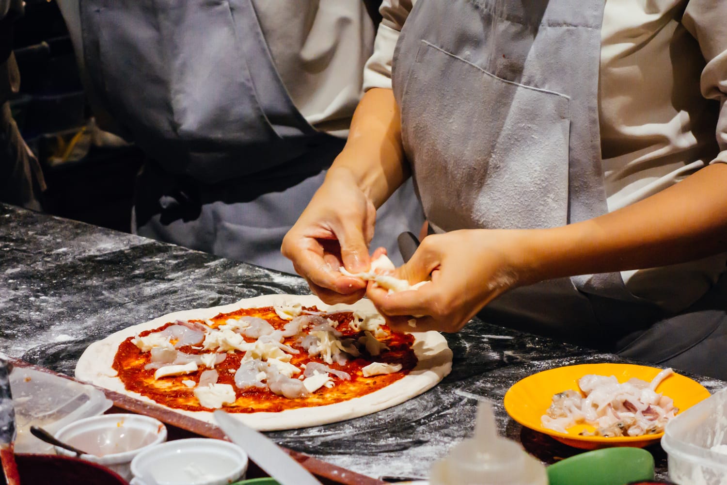 Pizza making at cooking class in Italy