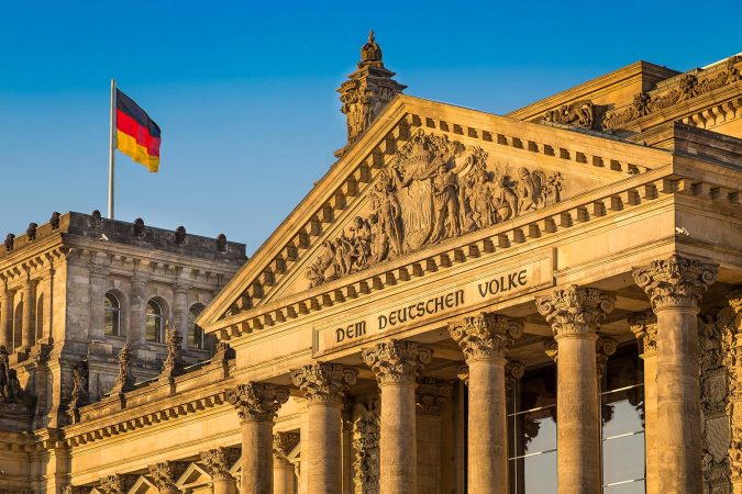 Close-up view of famous Reichstag building, seat of the German Parliament (Deutscher Bundestag), in beautiful golden evening light at sunset, Berlin Mitte district, Germany