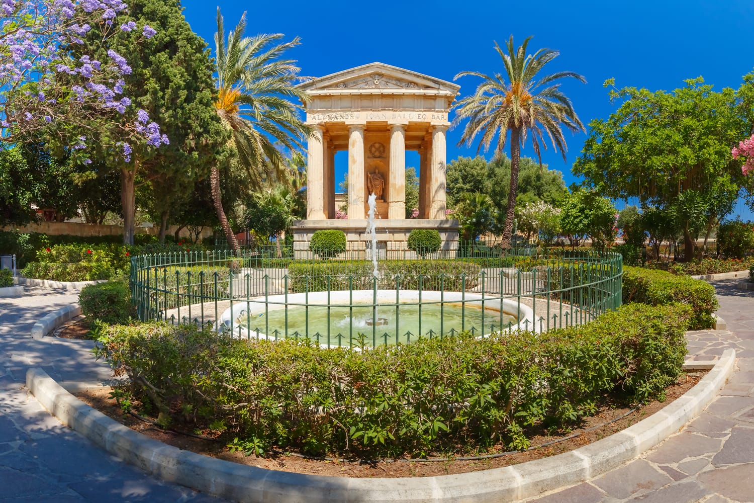 Panorama of blossoming spring Lower Barrakka Gardens and monument dedicated to Alexander Ball in the old town Valletta, capital of Malta