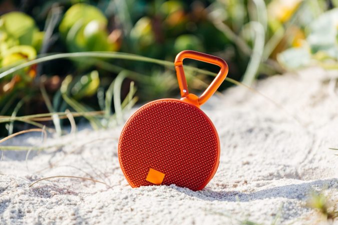 Portable bluetooth speaker on the beach