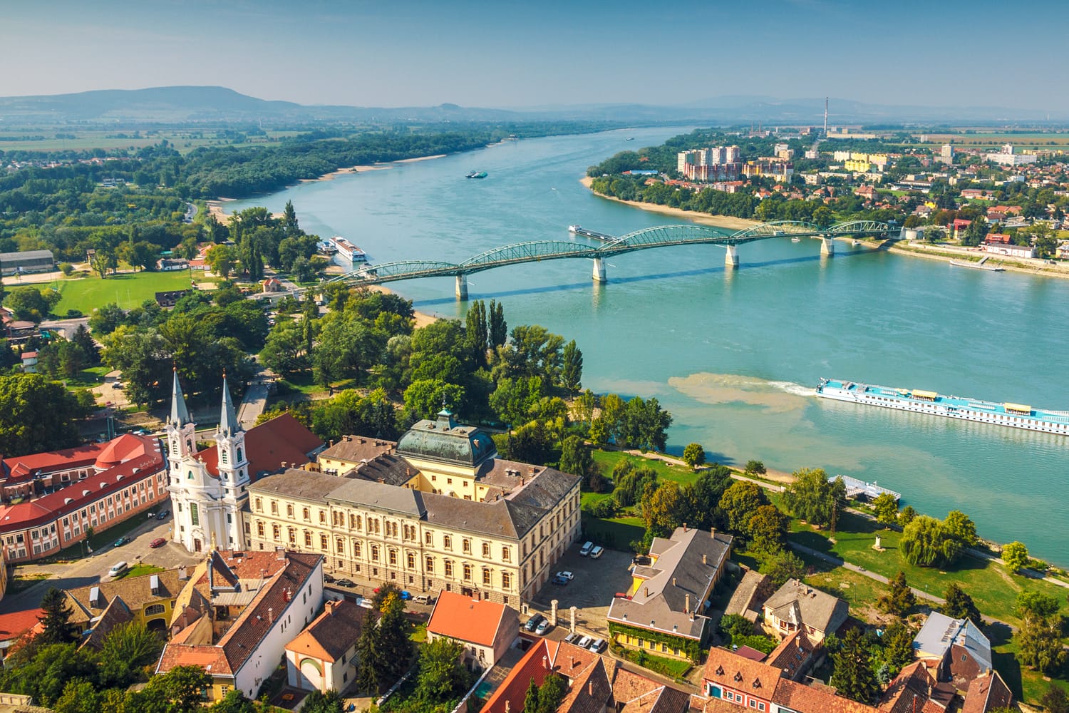 View of the Hungarian historic town from the basilica in Esztergom, the Danube river and the border bridge to the town of Sturovo in Slovakia.