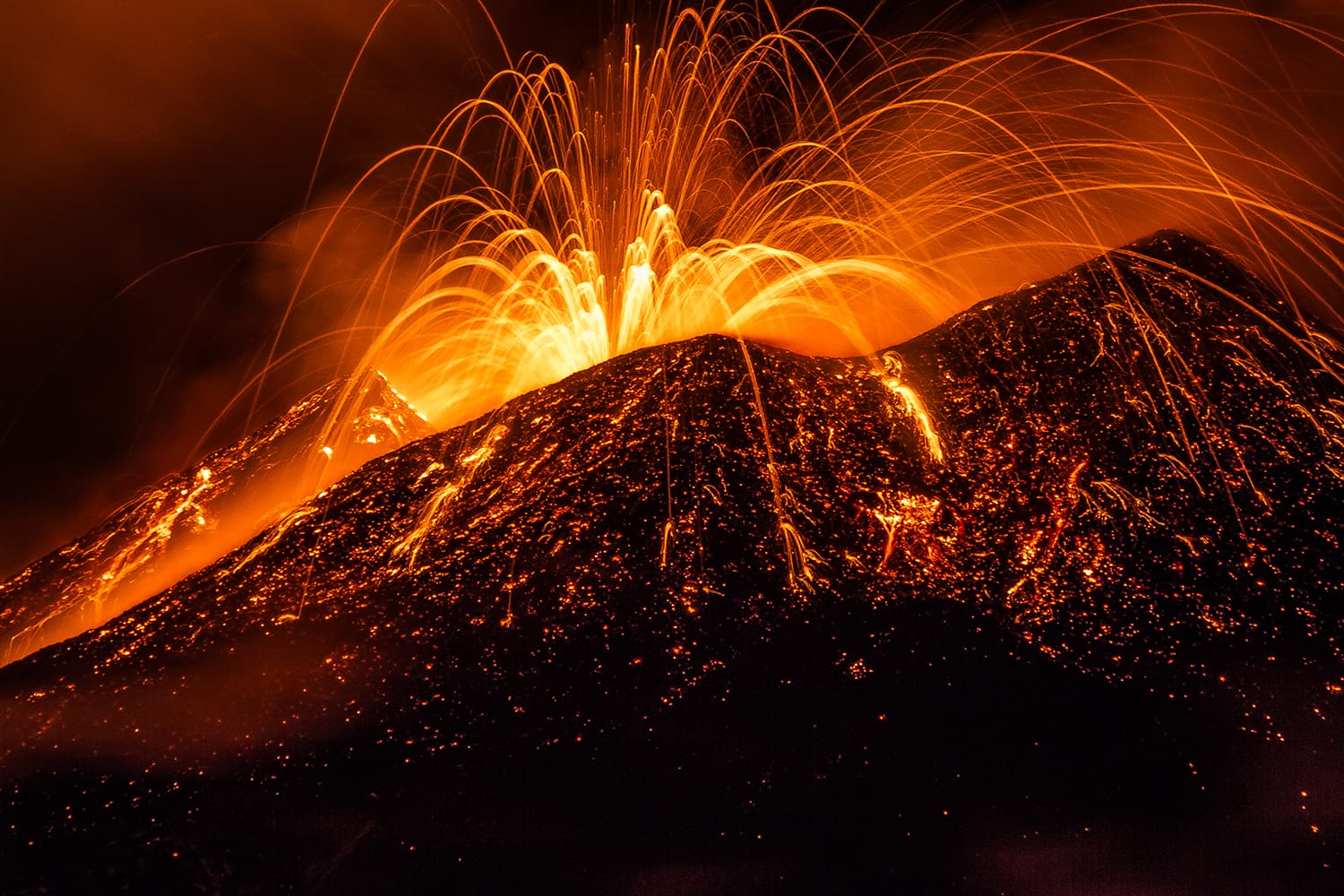 Lava flowing from Mount Etna, Italy
