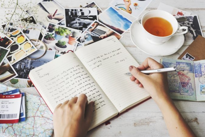Writing in travel journal