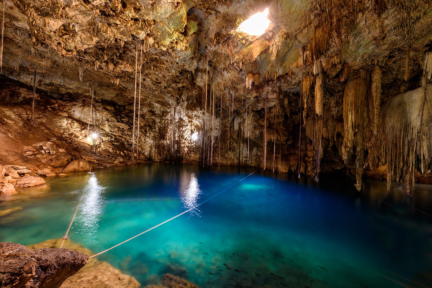 Crystal blue water in Cenote XKeken (XQuequen) in Dzitnup village near Valladolid city - Yucatan Peninsula - Mexico