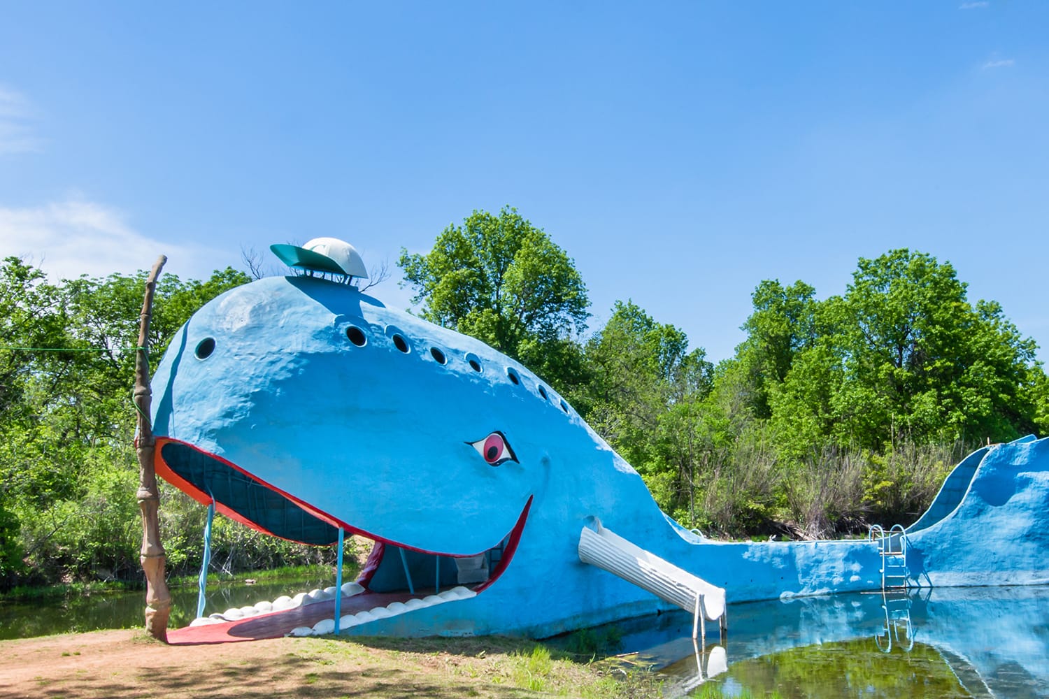 Iconic Blue Whale floating in "Natures Acres" pond, on Route 66 in Oklahoma