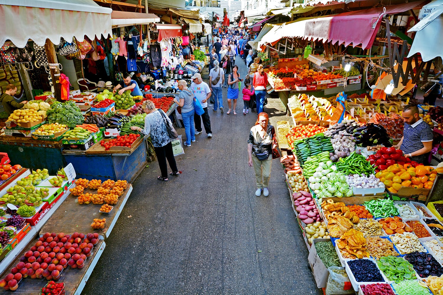 Shoppers at Carmel Market Shuk HaCarmel in Tel Aviv, Israel