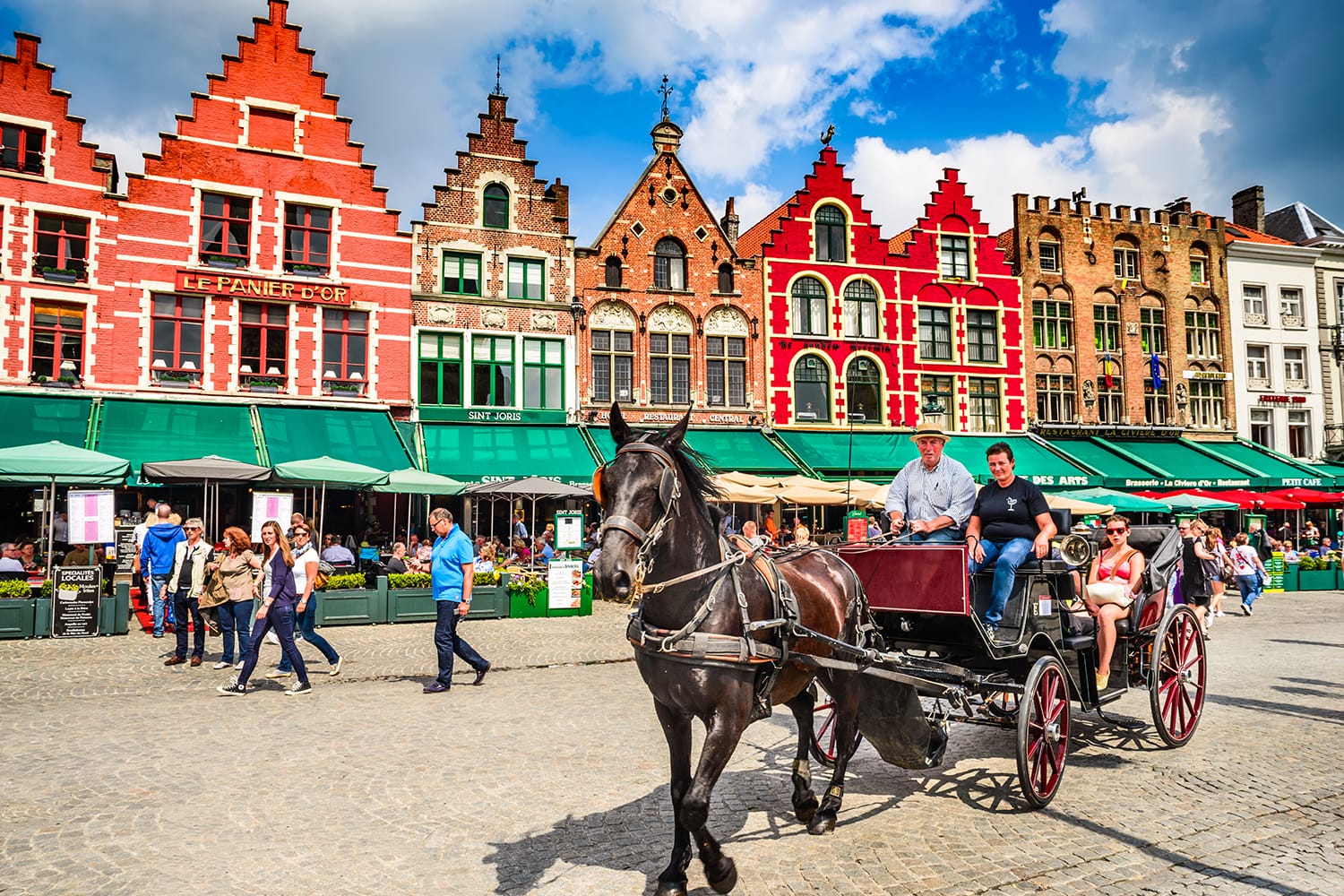 Horse carriage on Grote Markt square in Bruges, Belgium