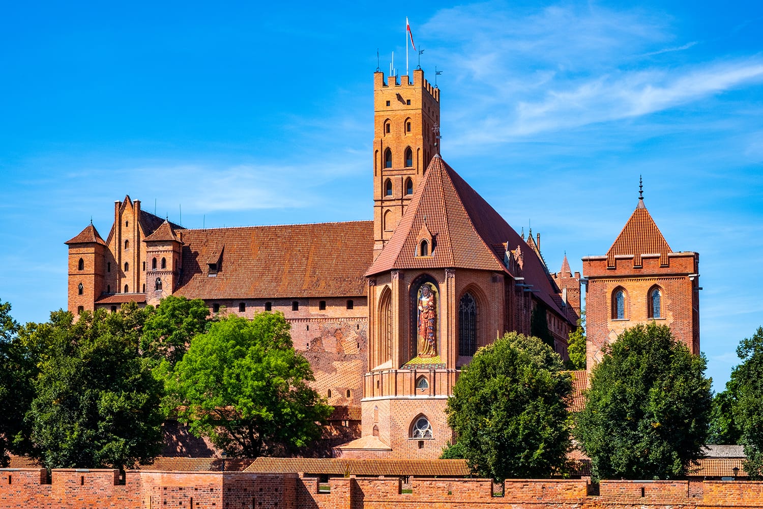 Panoramic view of the medieval Teutonic Order Castle in Malbork, Poland - High Castle and St. Mary church