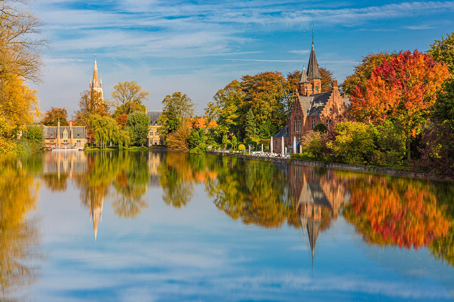 Minnewater castle at the Lake of Love in Bruges, Belgium