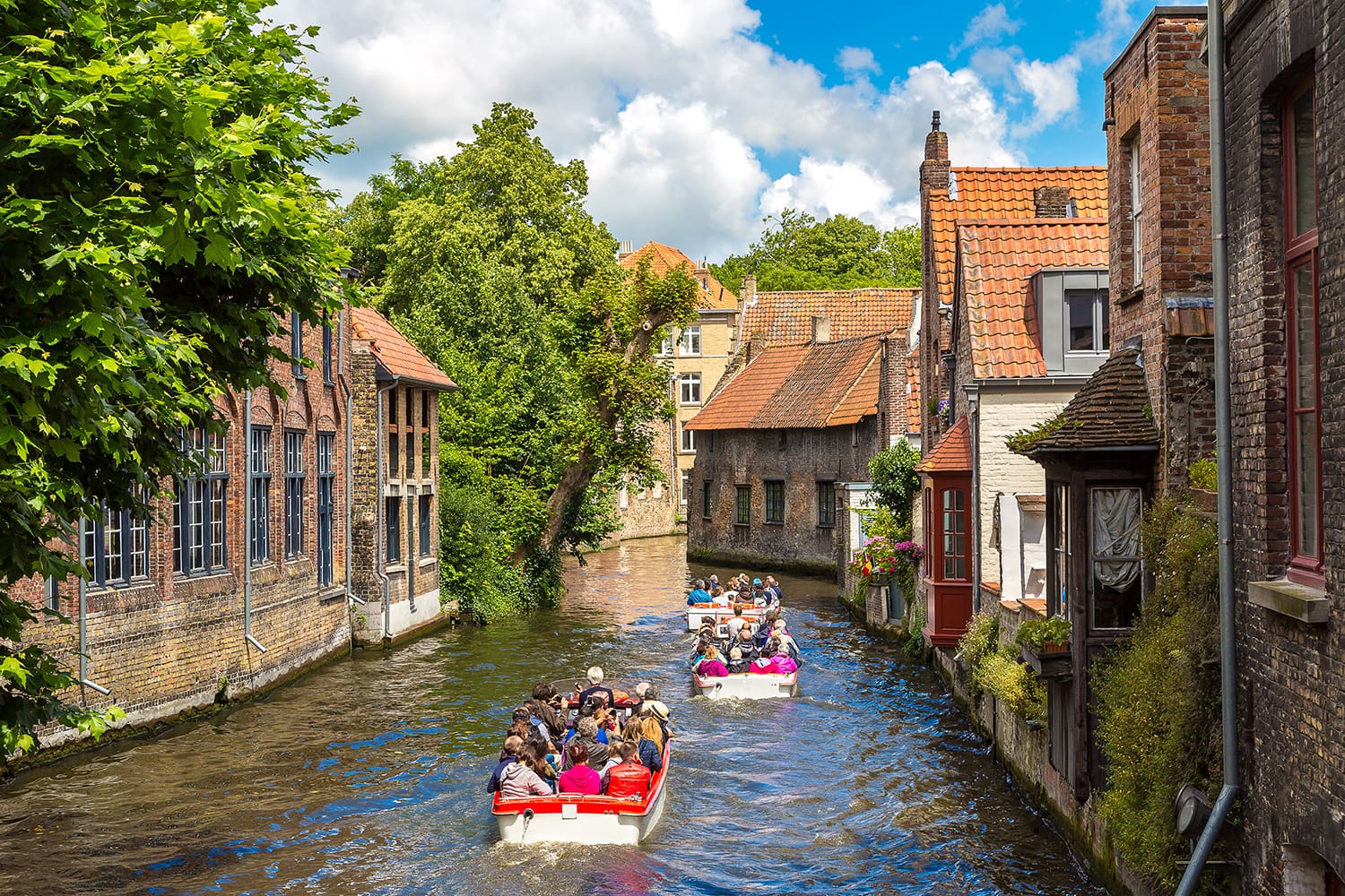Tourist boat on canal in Bruges, Belgium