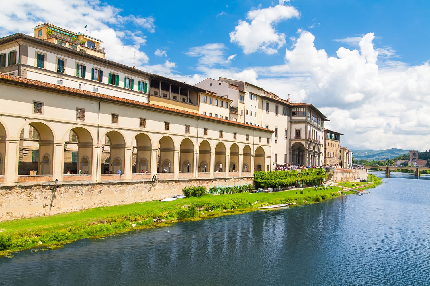 The embankment of river Arno. View of the Uffizi Gallery. Italy, Florence