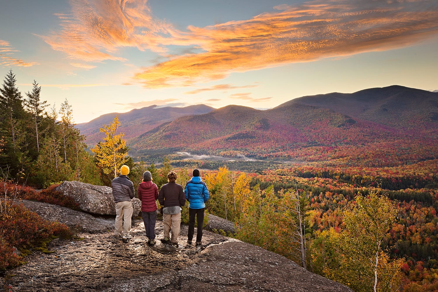 Group of hikers enjoying the view in the Adirondacks Mountains, NY, USA
