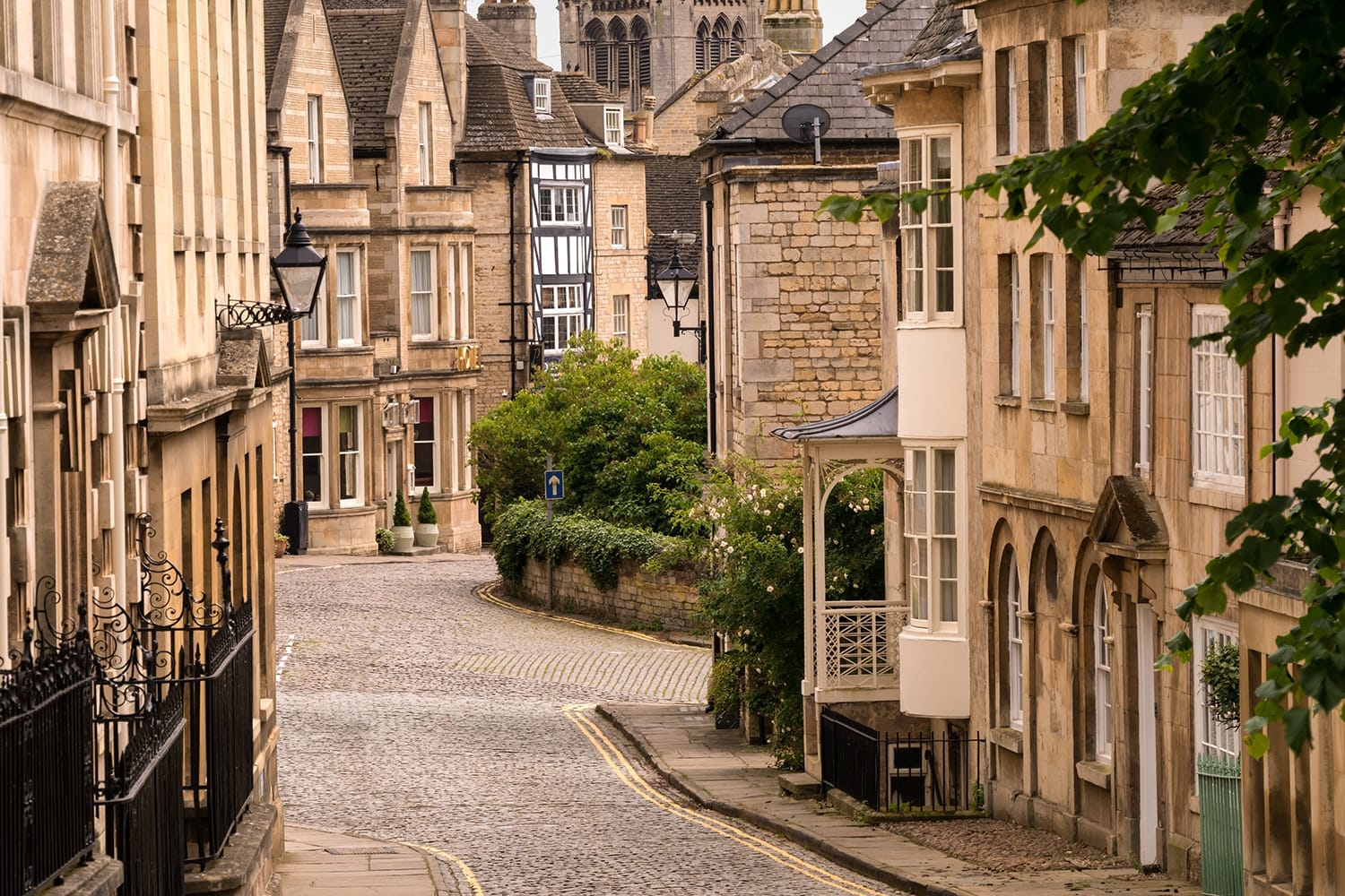 Old narrow cobbled street with stone houses, Barn Hill and All Saints Place, Stamford, Lincolnshire, England, UK