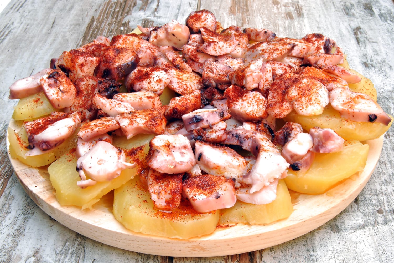 Octopus with paprika, potatoes and olive oil typical of Galicia, Spain