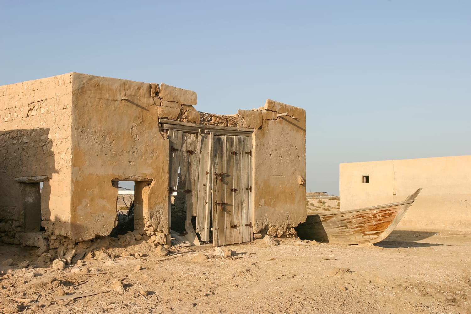 An old shed and fishing boat in Al Jazirat Al Hamra