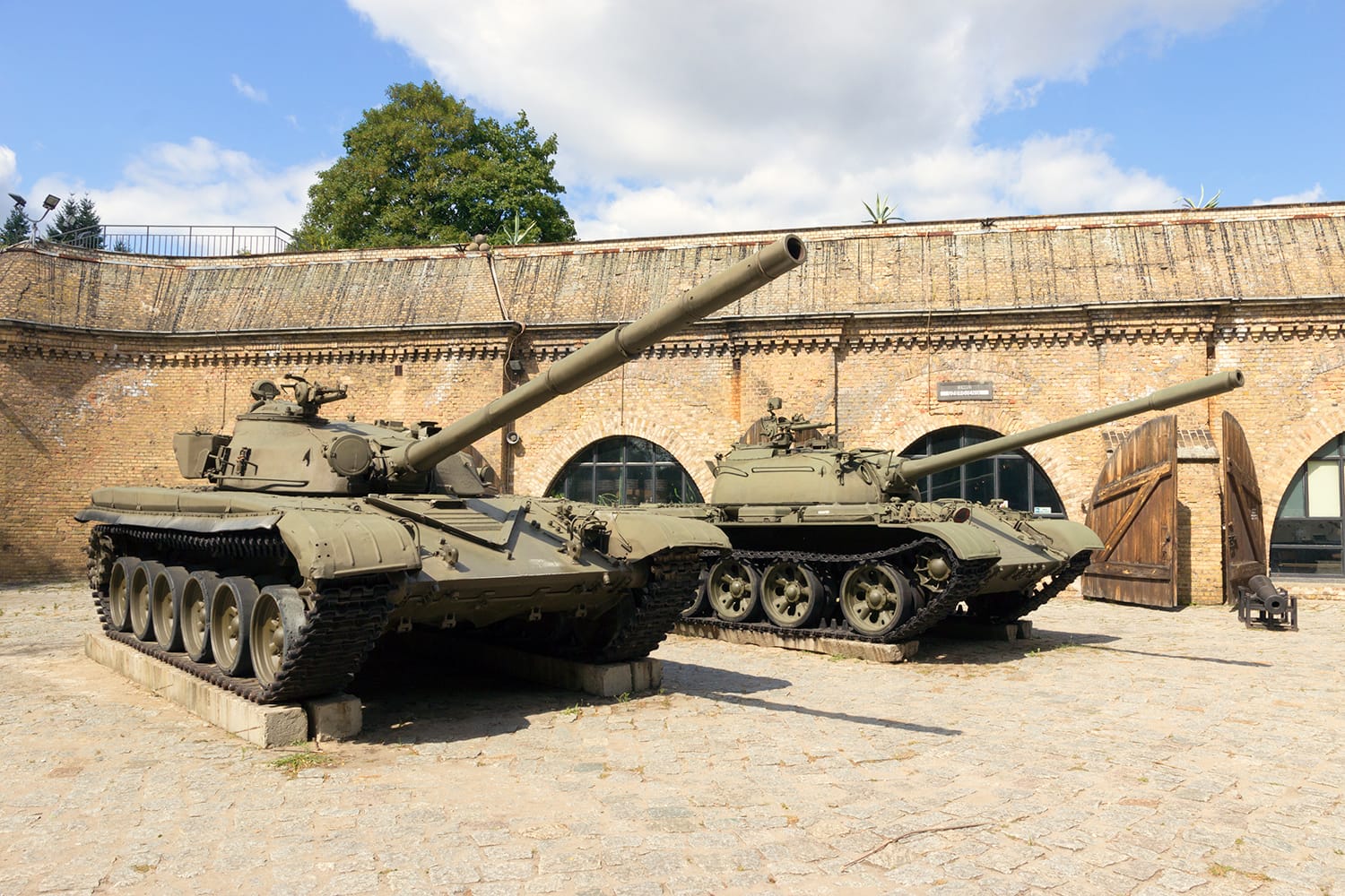 Preserved T-72 and T-55 tanks on display in front of the Poznan Army Museum.