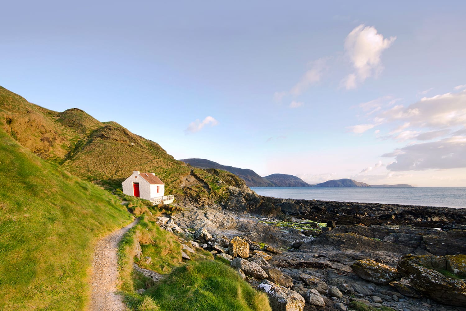 Path to the White Fisherman Cottage on a coast - Niarbyl on the Isle of Man