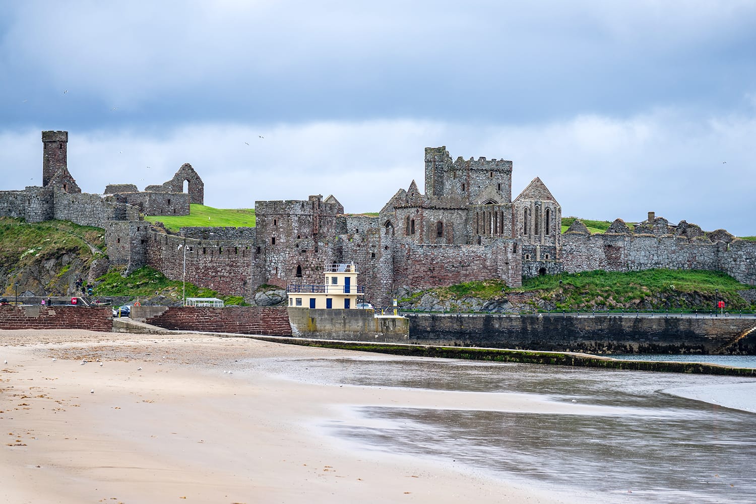 Peel Castle is on St Patrick's Isle, a small island connected to Peel Hill by a causeway.