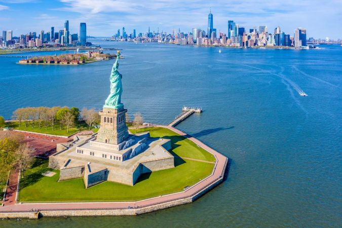 Aerial View of Statue of Liberty, Ellis Island and Lower Manhattan Skyline