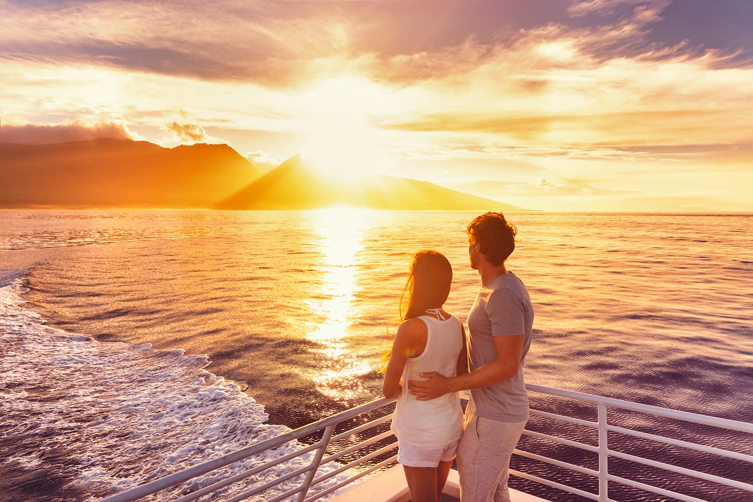 A couple on sunset cruise in Hawaii
