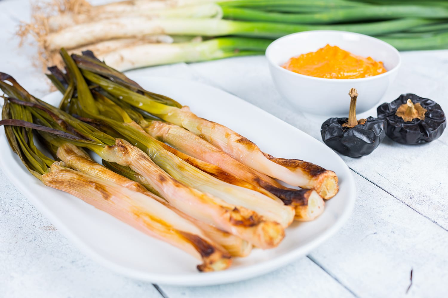 Calçots cooked on the fire, typical food of Catalonia