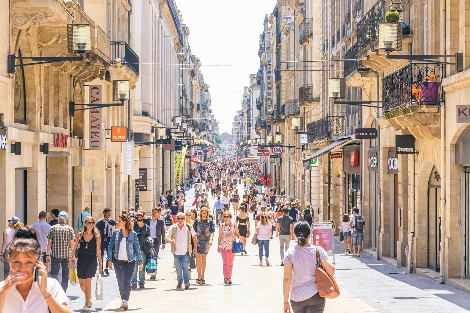 People walk on Rue Sainte-Catherine in center of Bordeaux, France