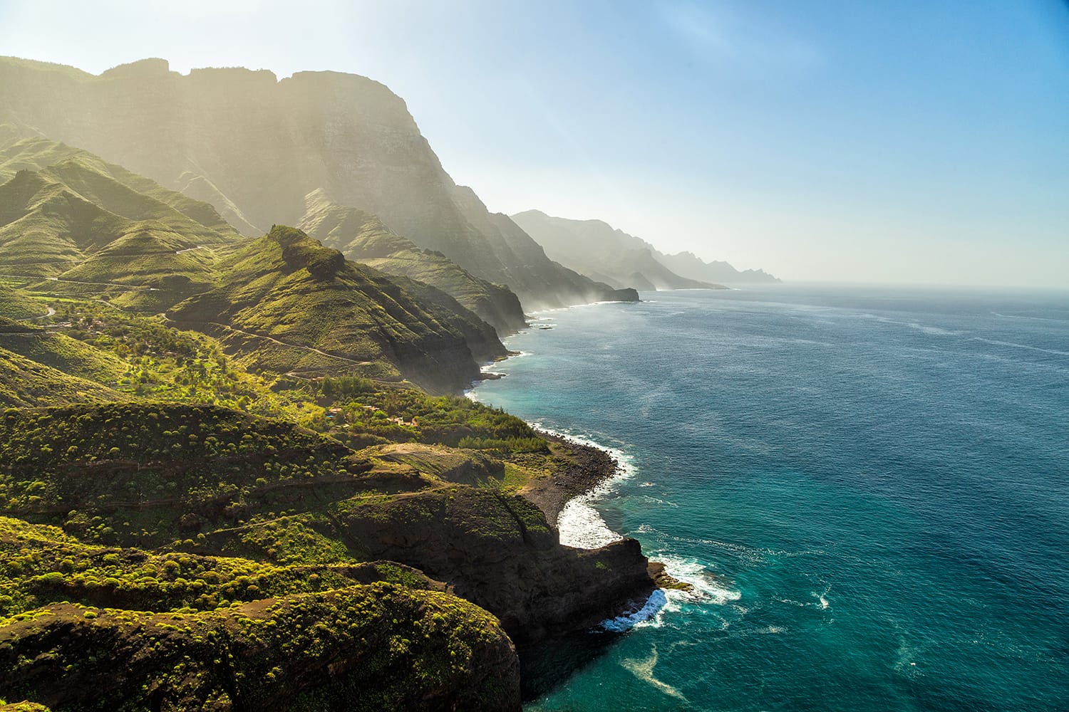 Green hills and cliffs of Tamadaba Natural Park on the coast of the ocean near Agaete, Las Palmas, Gran Canaria island, Spain