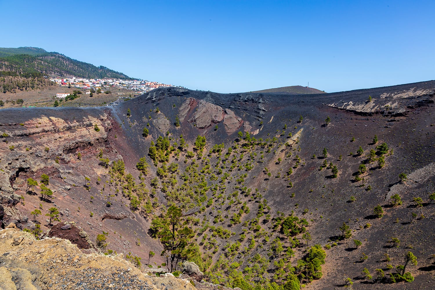 View of the San Antonio volcano crater with fuencaliente village in background. La Palma, Canary Islands. Spain.