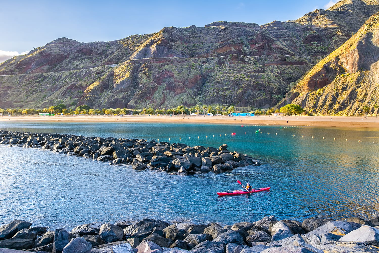 View of beach las Teresitas with yellow sand and with a kayak in the foreground in Santa Cruz de Tenerife, Tenerife, Canary Islands.