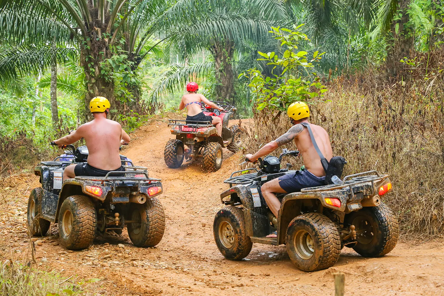 Tourists riding ATVs in Thailand