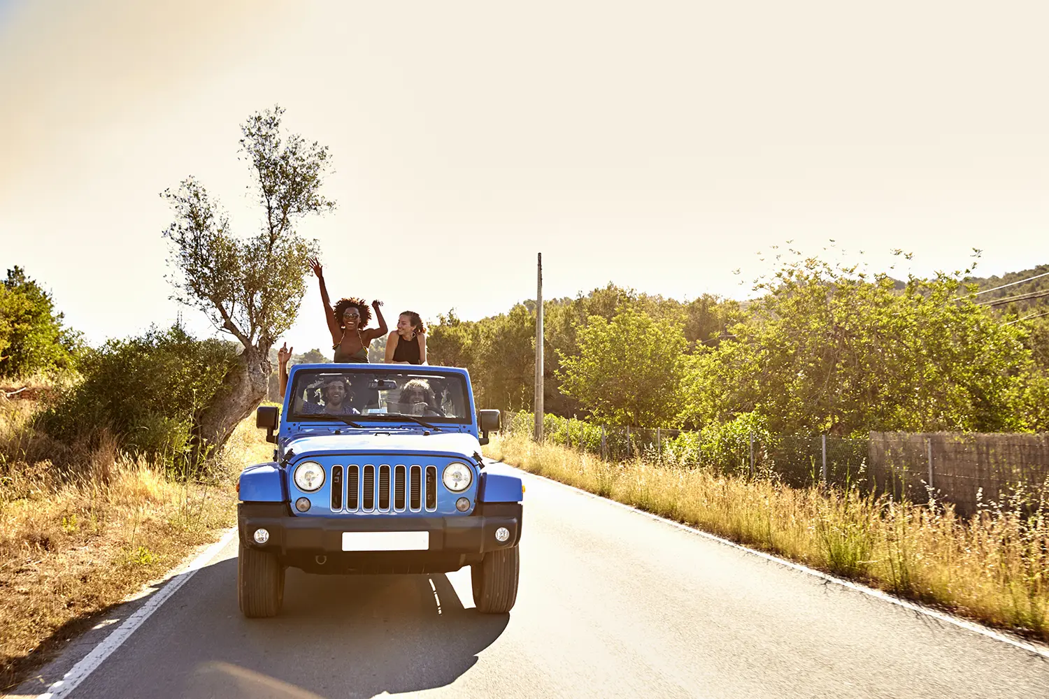 Friends driving a Jeep on Ibiza, Spain
