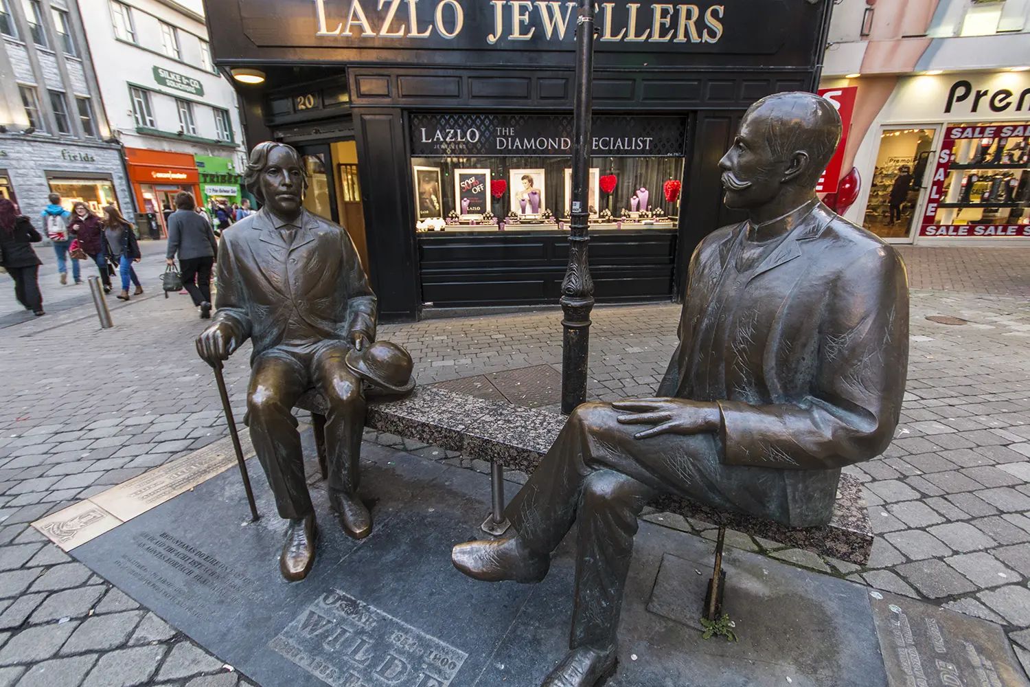 Statue of Oscar Wilde and Eduard Vilde in the city center of Galway - Ireland.