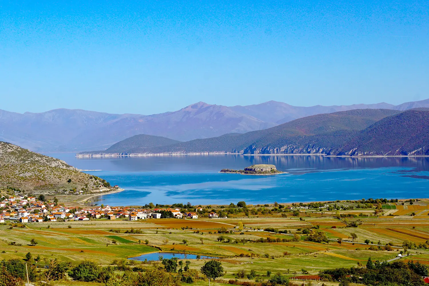Lake Prespa in Albania and island Maligrad in autumn.