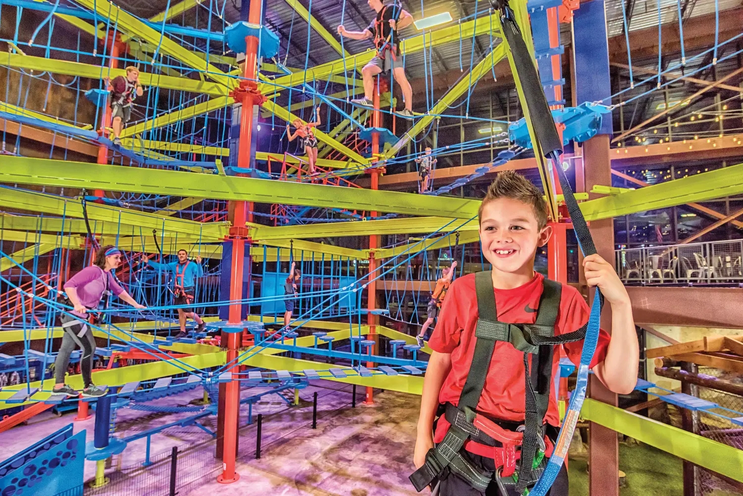 A boy having fun on the giant multi-story ropes course at Fritz's Adventures in Branson, MO